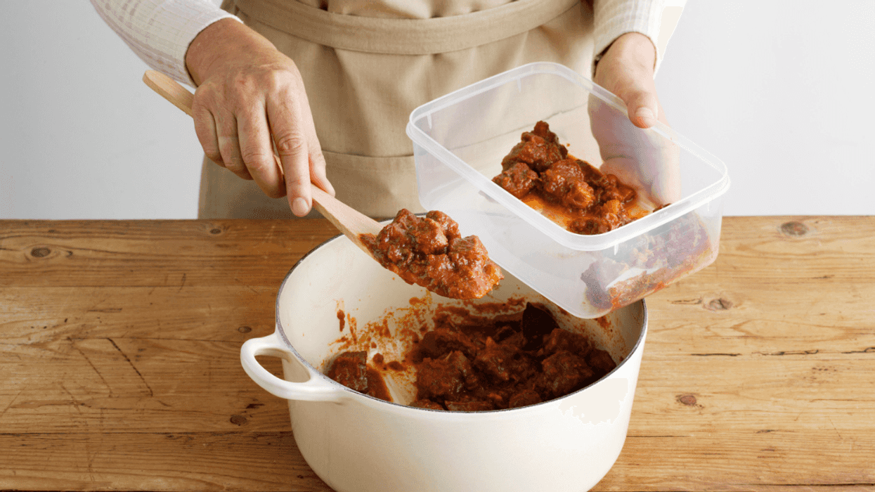 Woman packing leftovers
