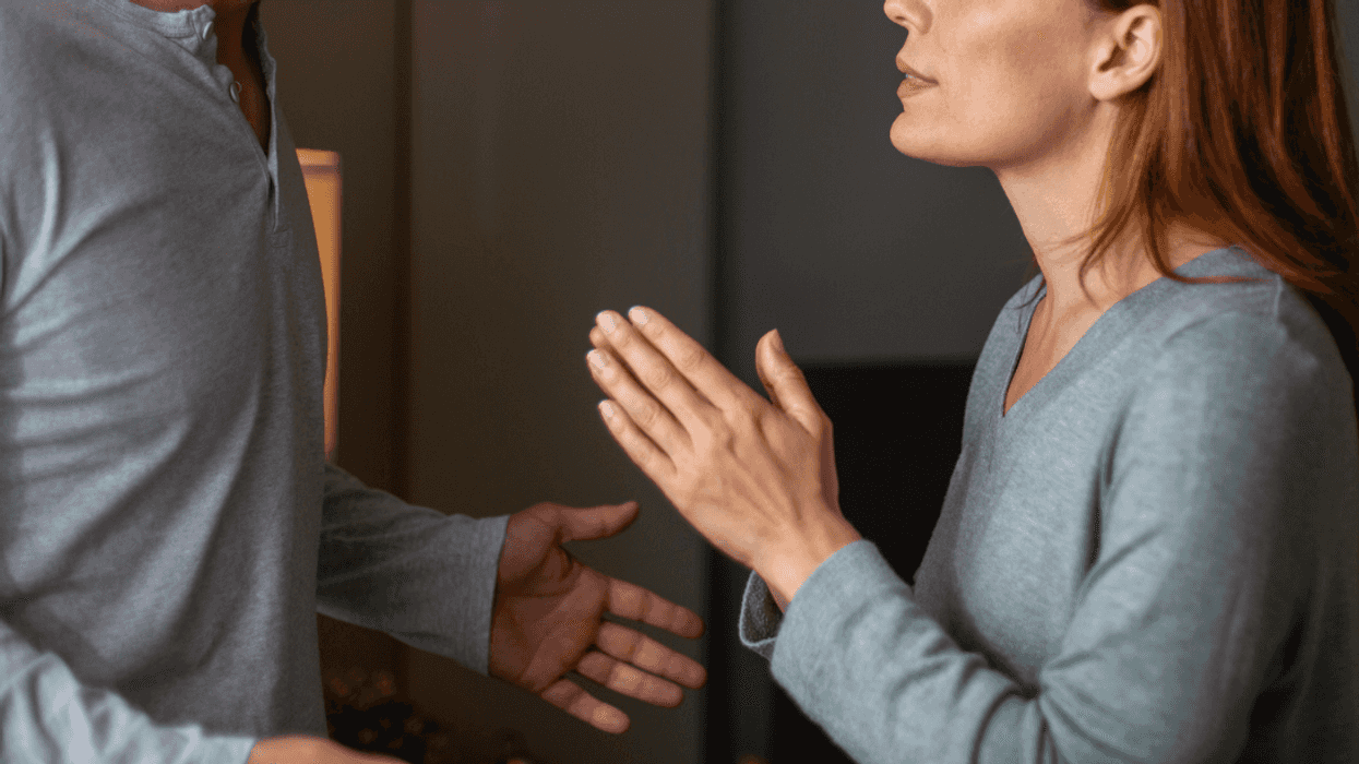 Woman pleading with partner