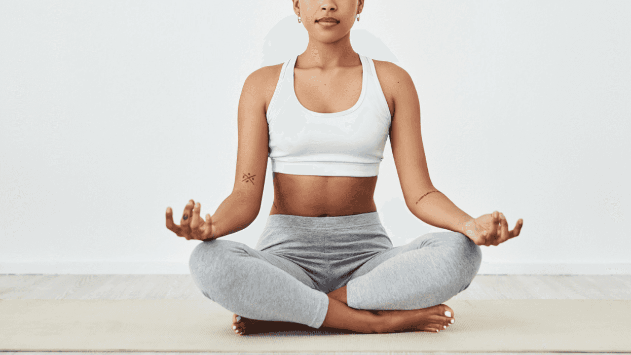 Woman practicing yoga while wearing a sports bra