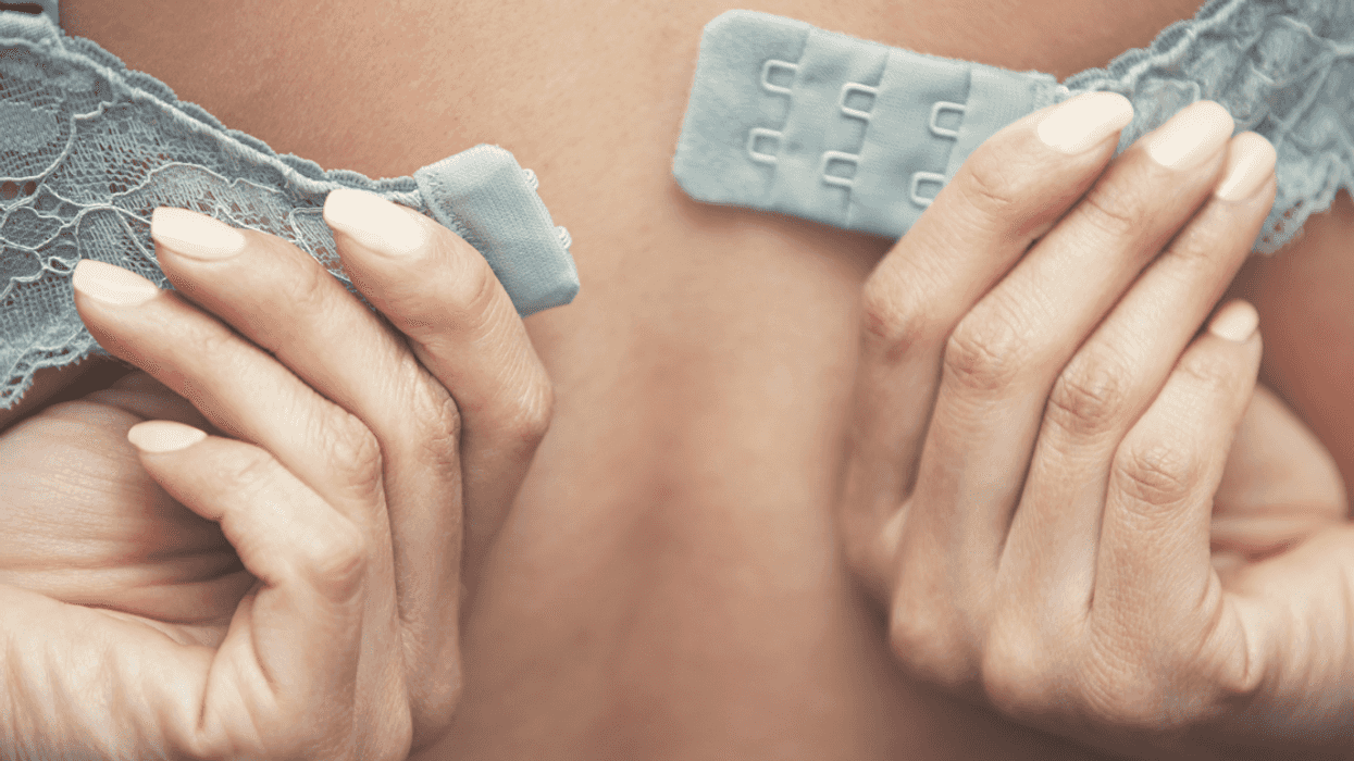 Woman putting on a bra