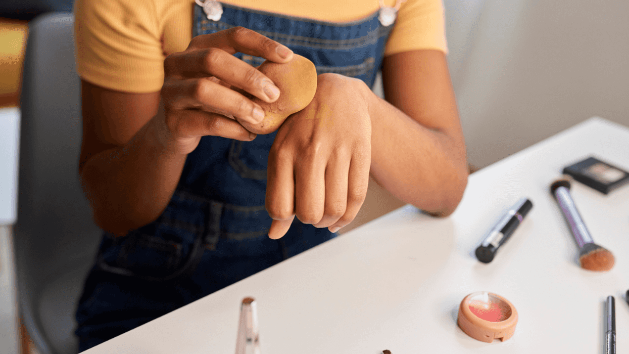Woman putting on makeup