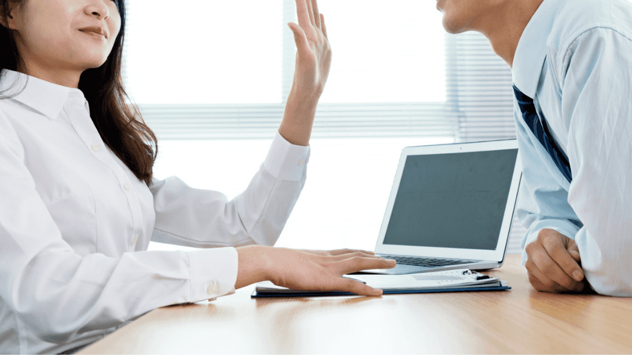 Woman refusing advances from male coworker