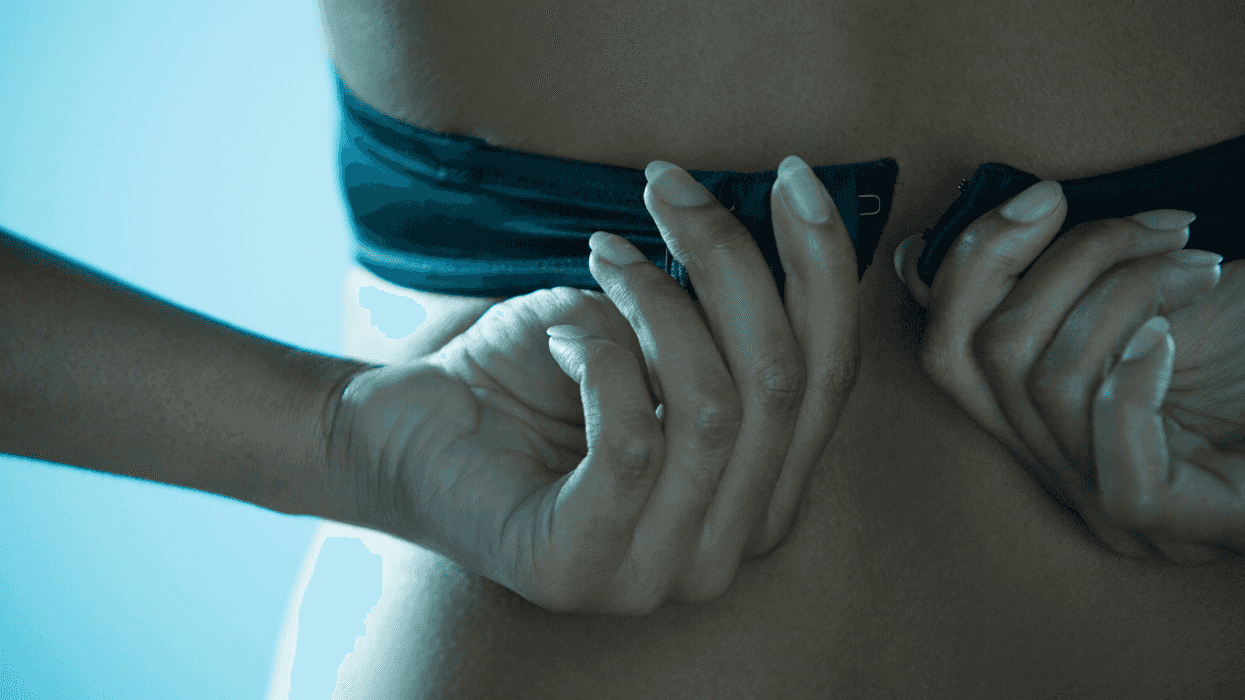 Woman removing her bra