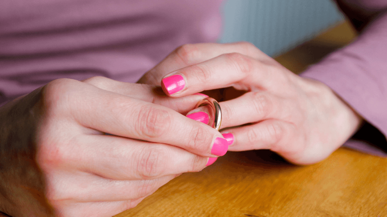 Woman removing her wedding ring
