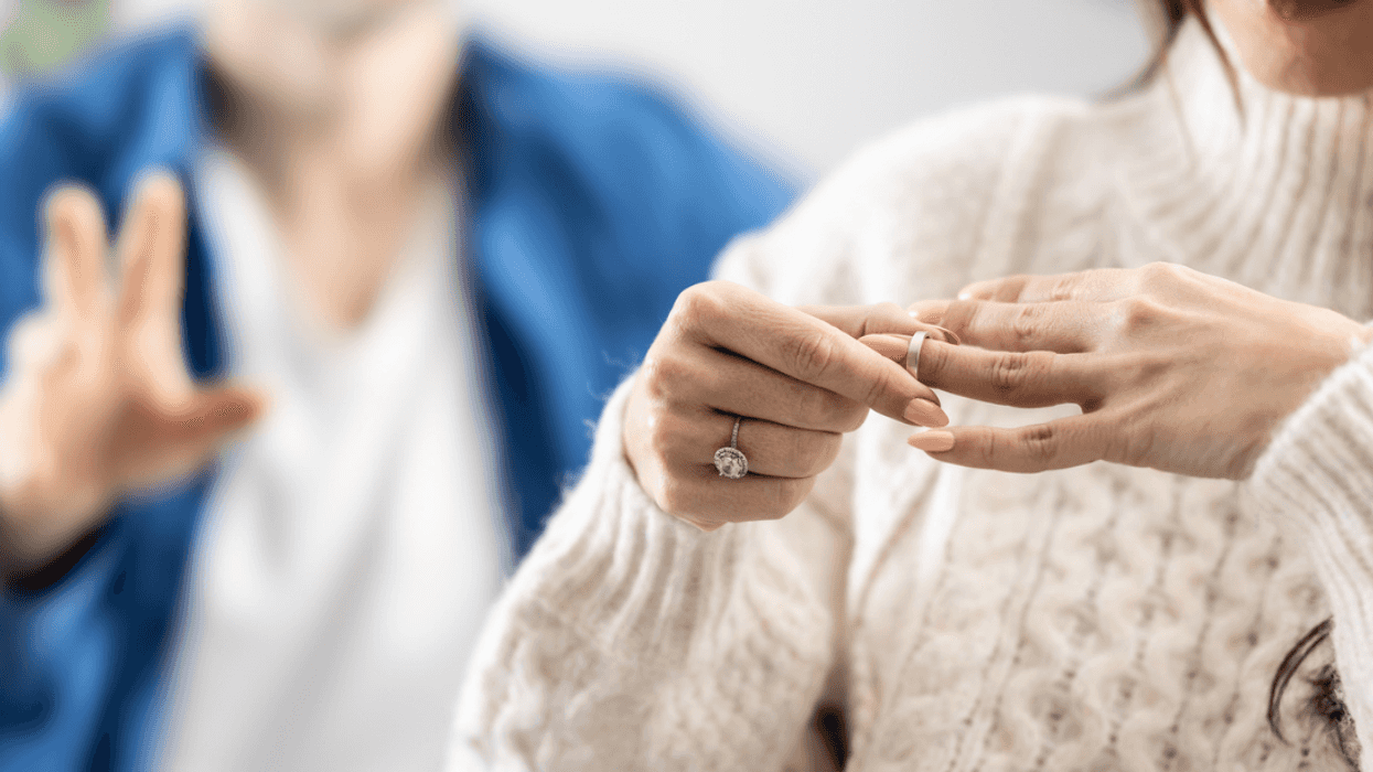Woman removing her wedding ring