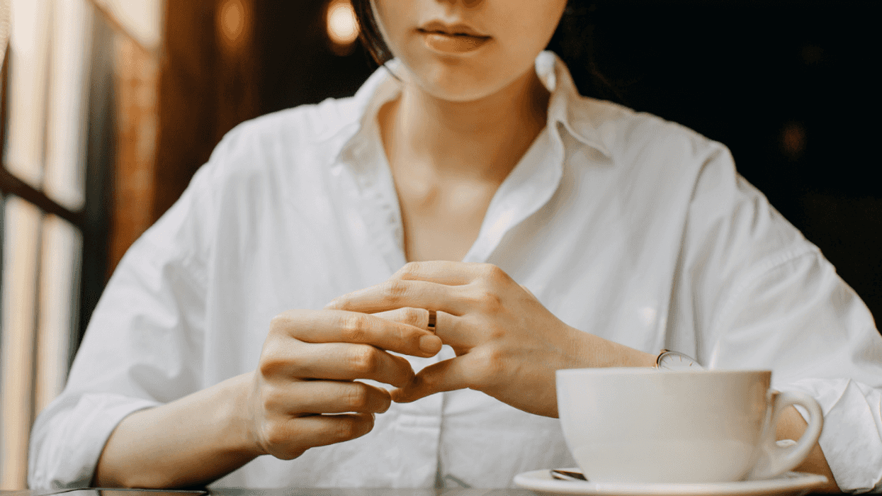 woman removing ring