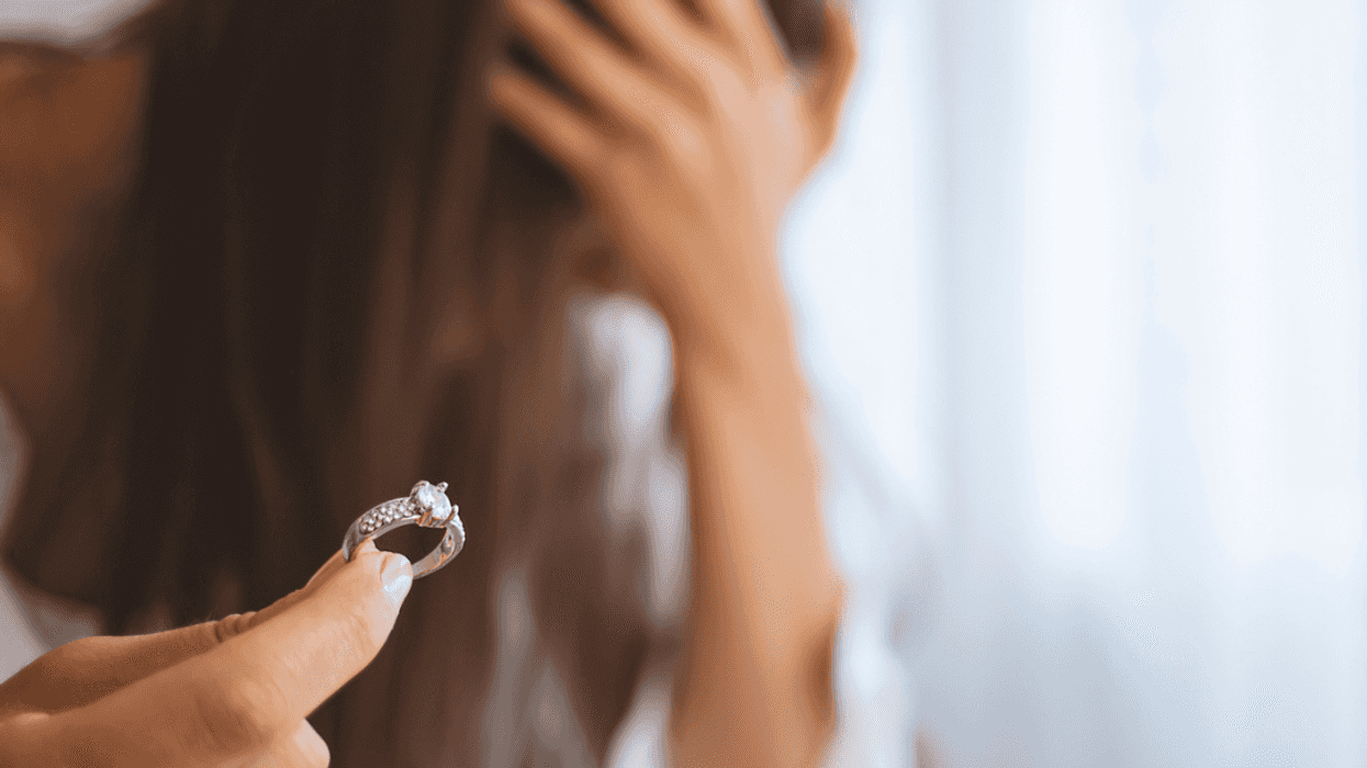 woman returning engagement ring