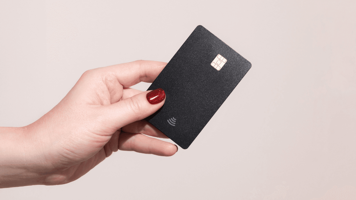 woman's hand holding credit card