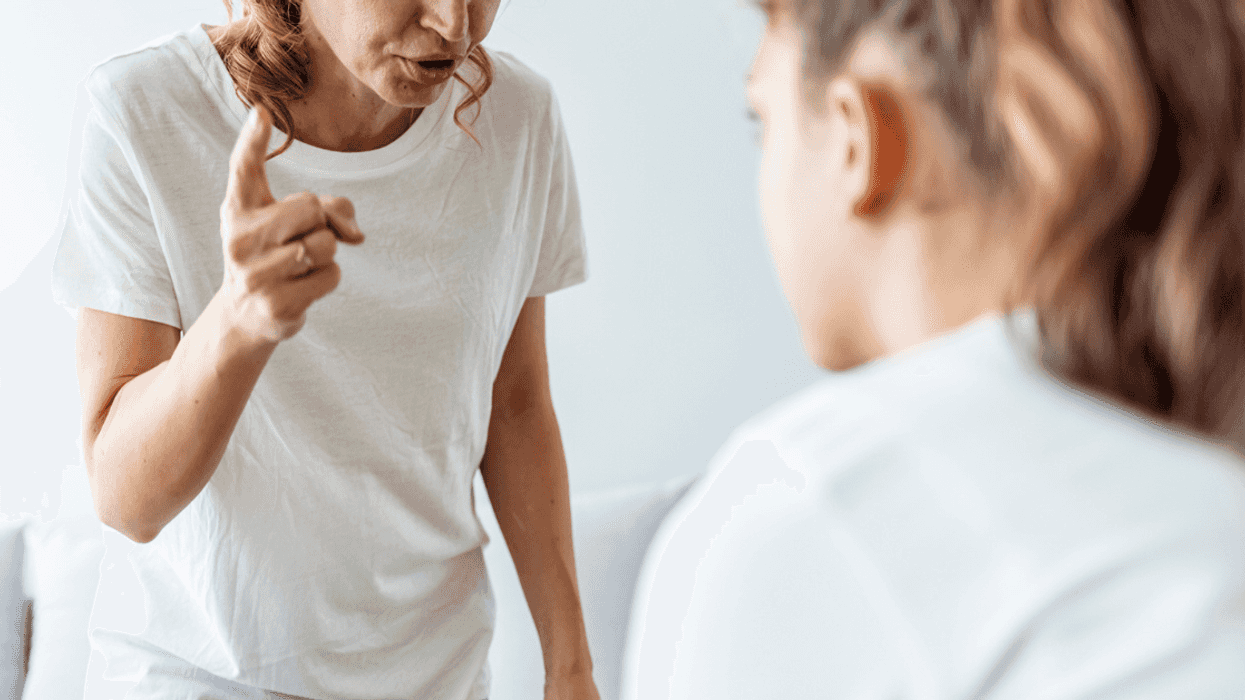 woman scolding teen girl