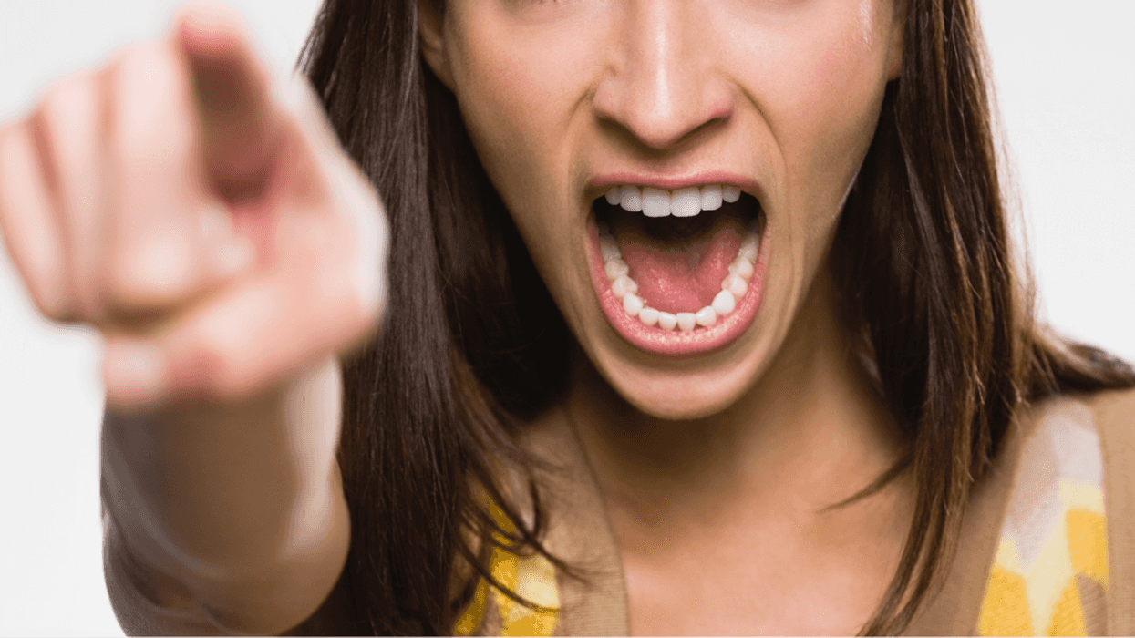 Woman screaming and pointing a finger.