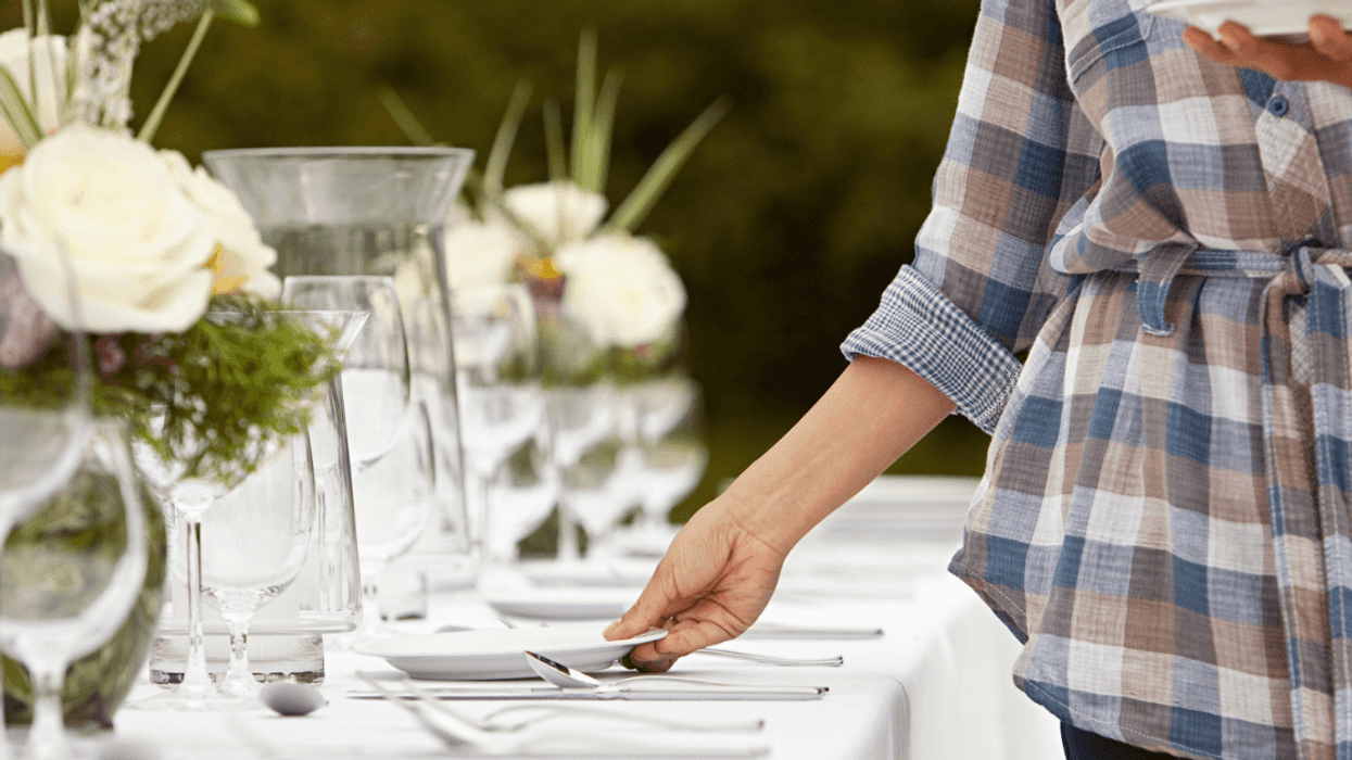 Woman setting table