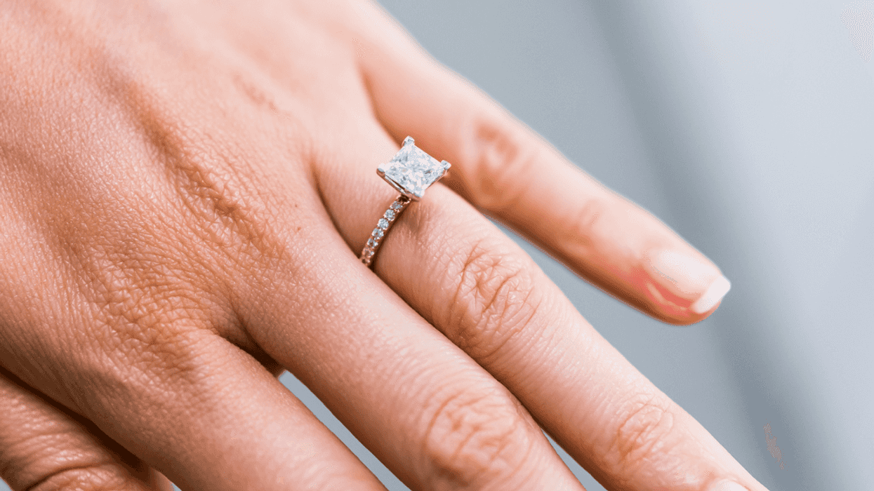 Woman showing off engagement ring.