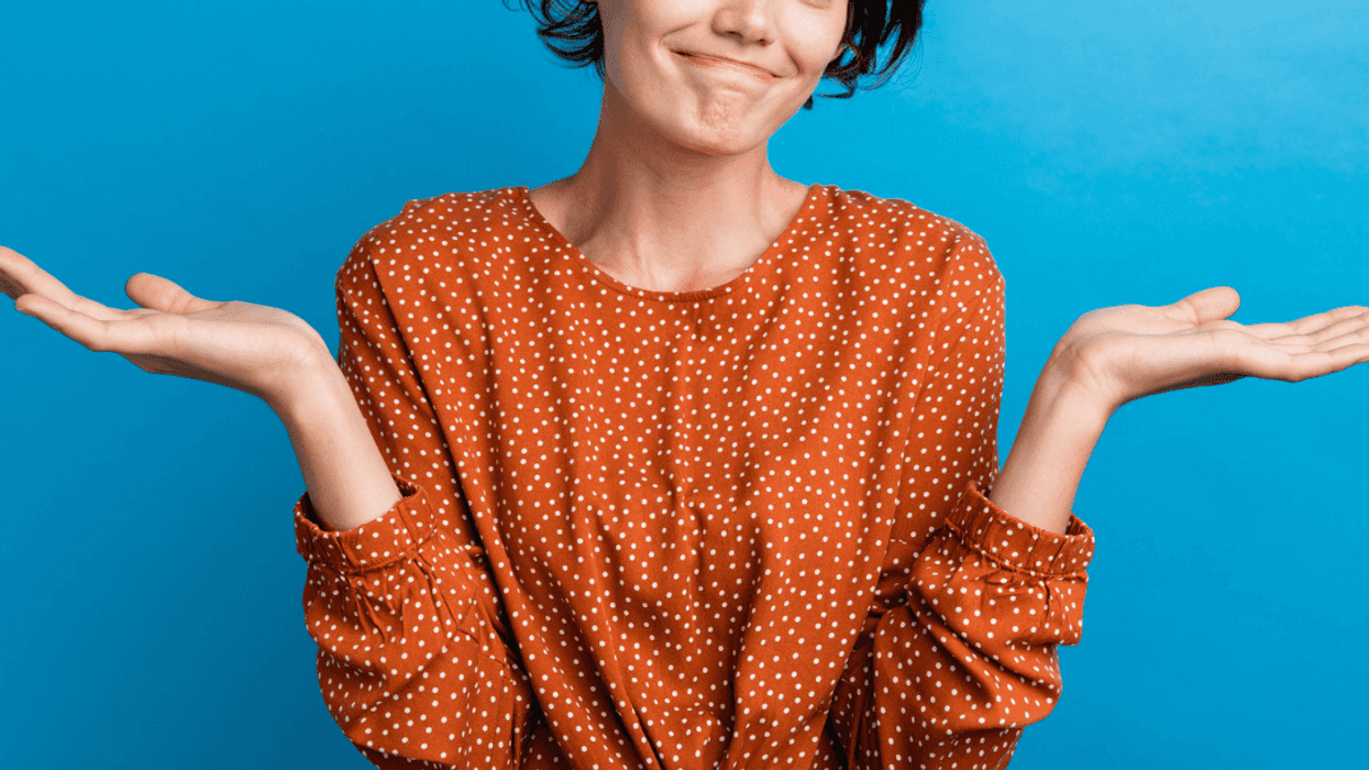 Woman shrugging her shoulders