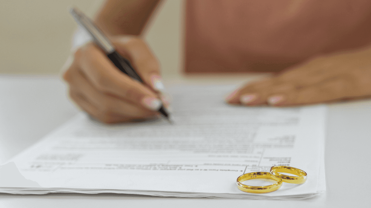 Woman signing divorce papers