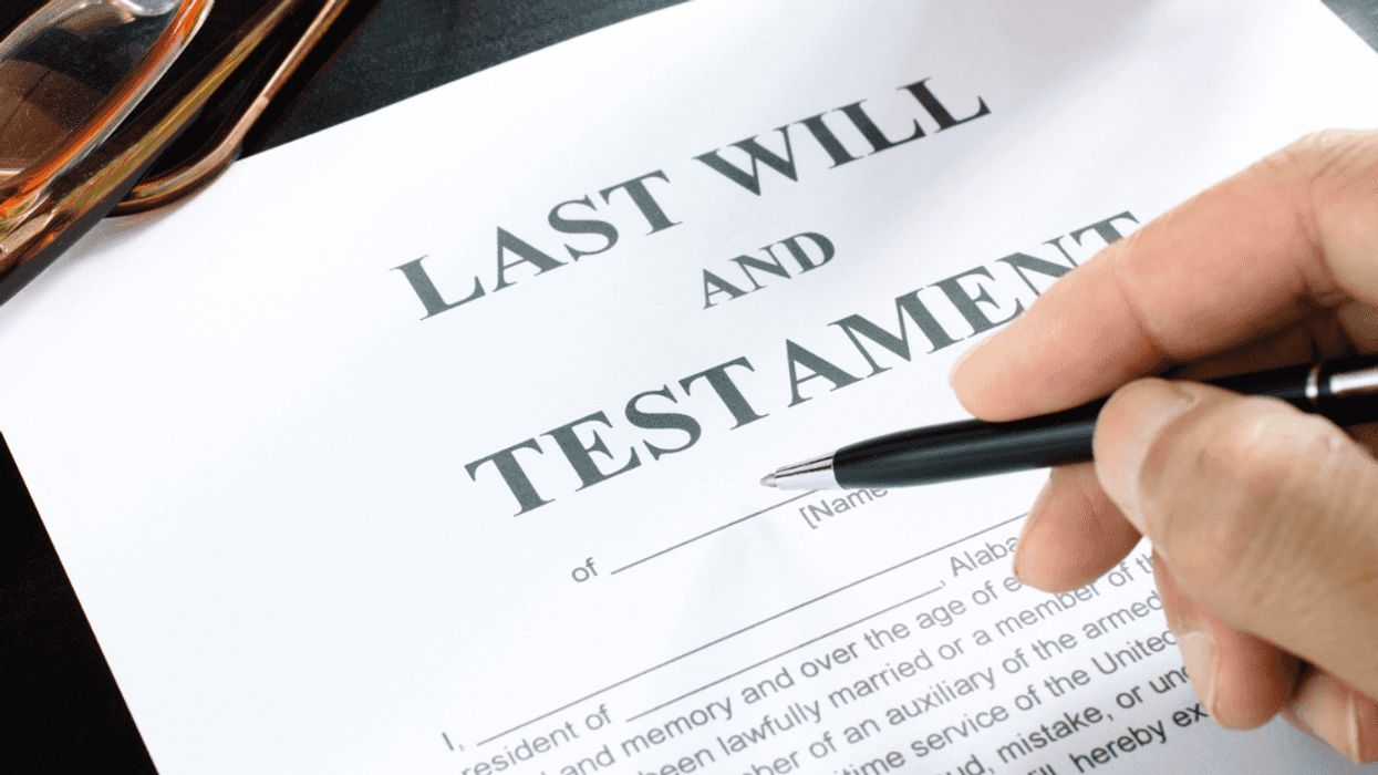 Woman signing her mother's last will and testament