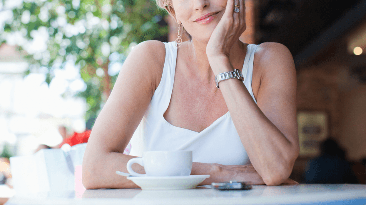 Woman sitting alone in coffee shop