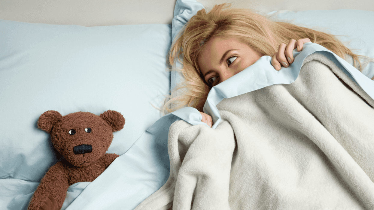 Woman sleeping with a stuffed animal