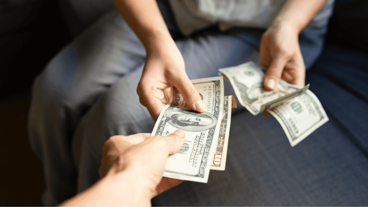 Woman taking money from man