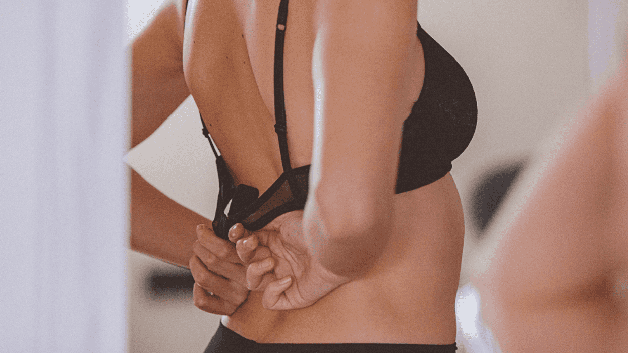 Woman taking off her bra