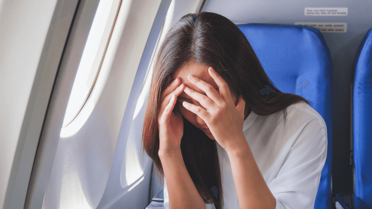 Woman upset on a plane