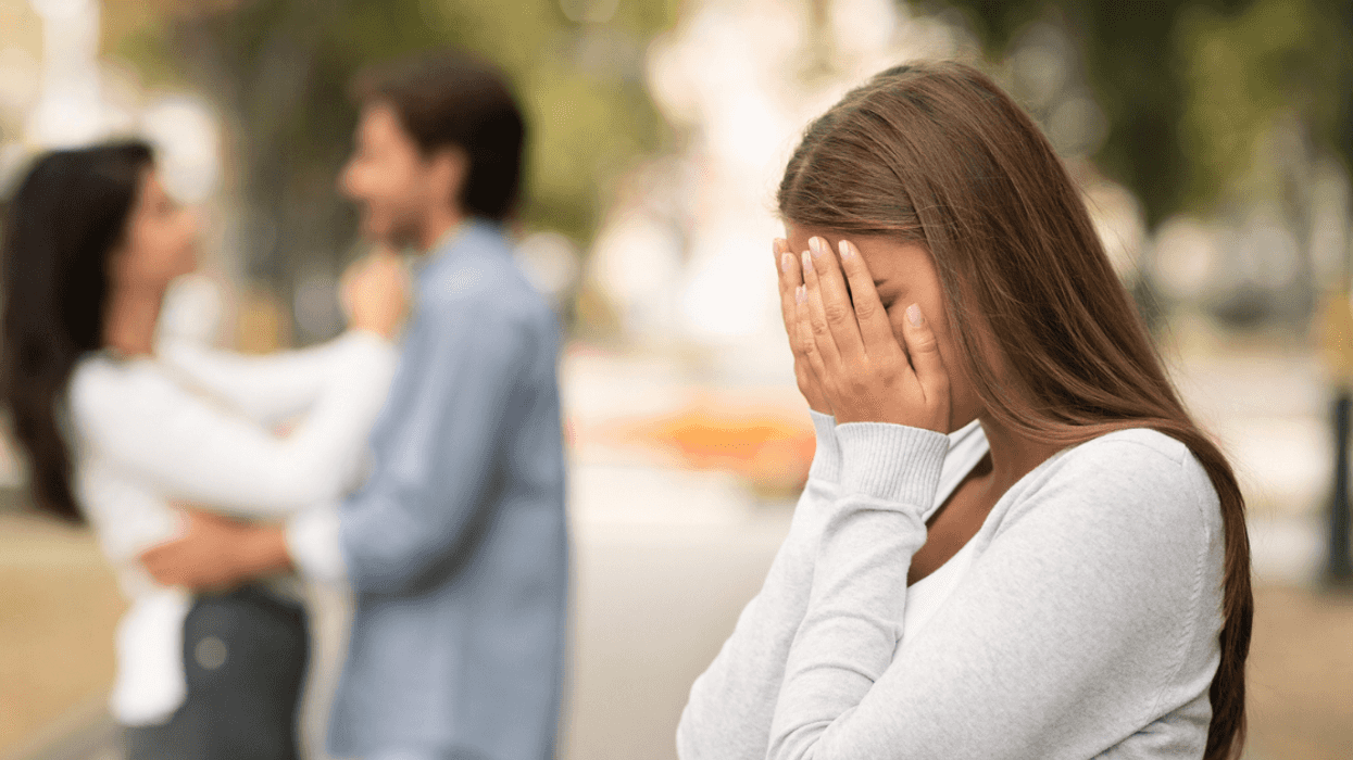 Woman upset seeing man with another woman