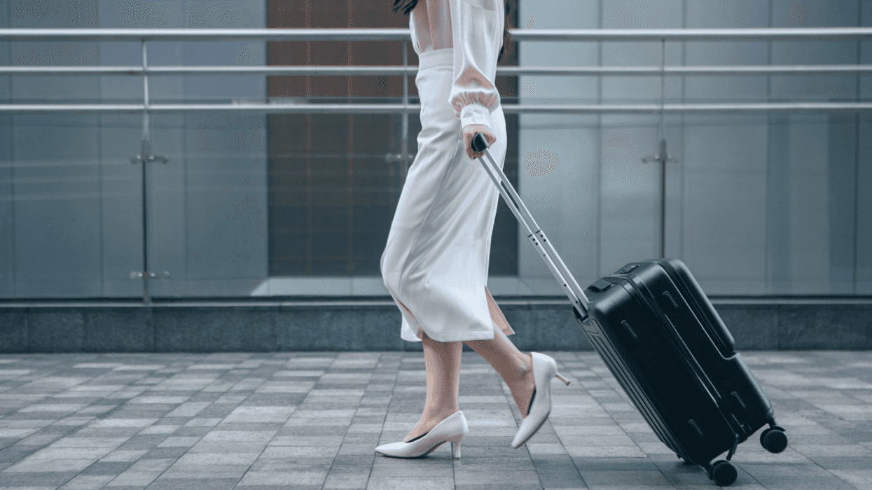 woman walking with suitcase