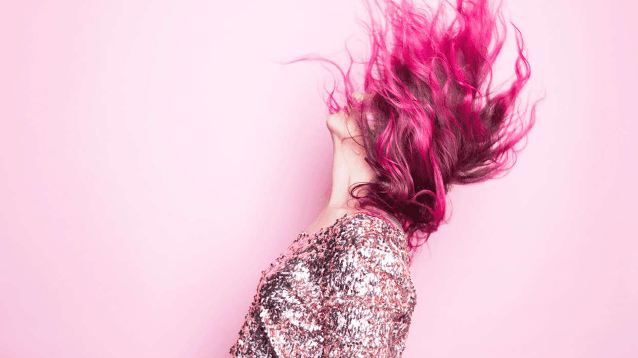 Woman waving pink hair