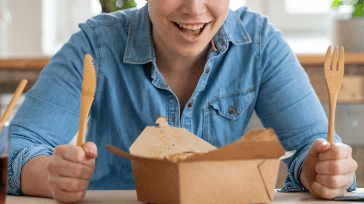 Woman with a takeout food box