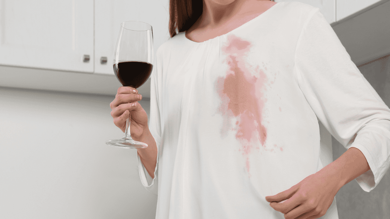 Woman with a wine stain on an expensive dress