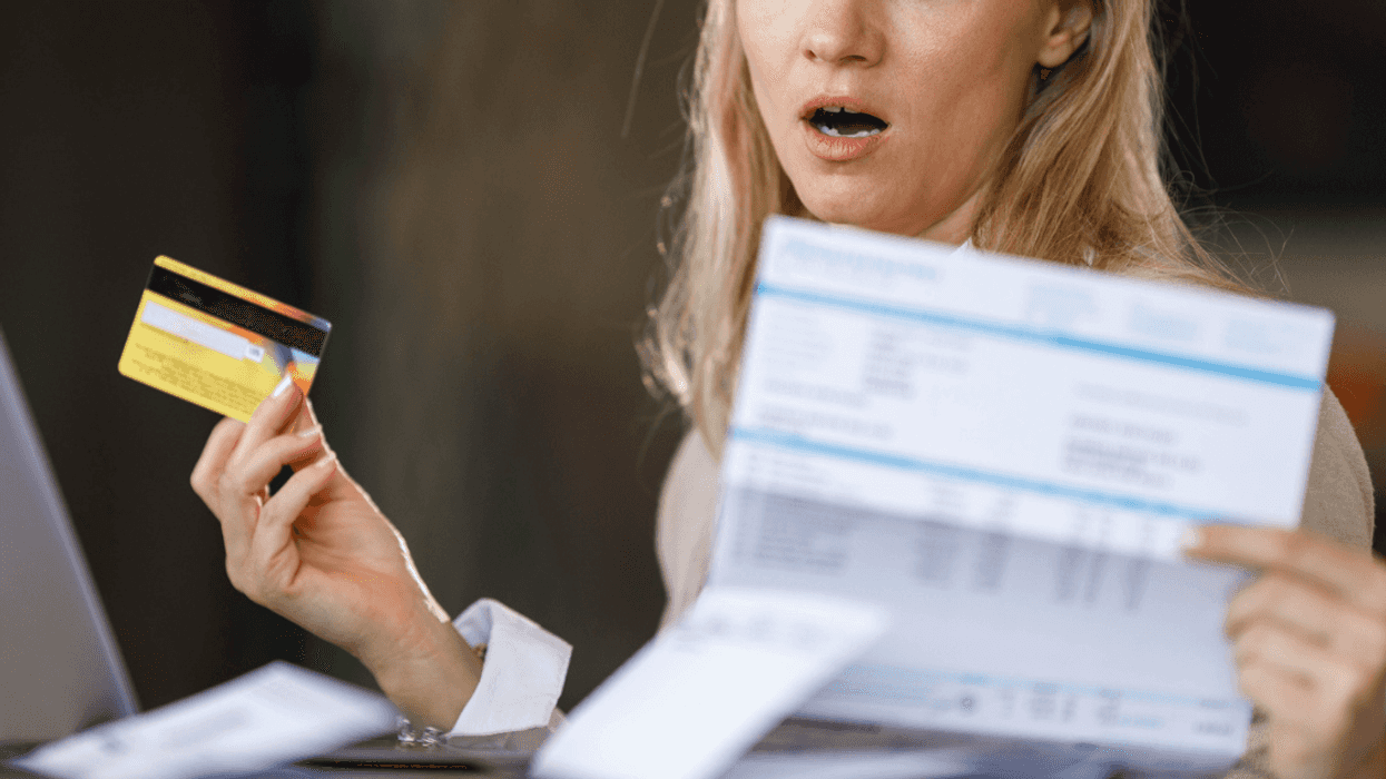 Woman with credit card realizing she's in trouble