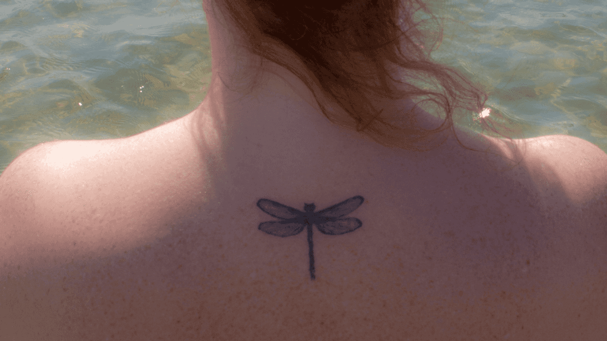 woman with dragonfly tattoo