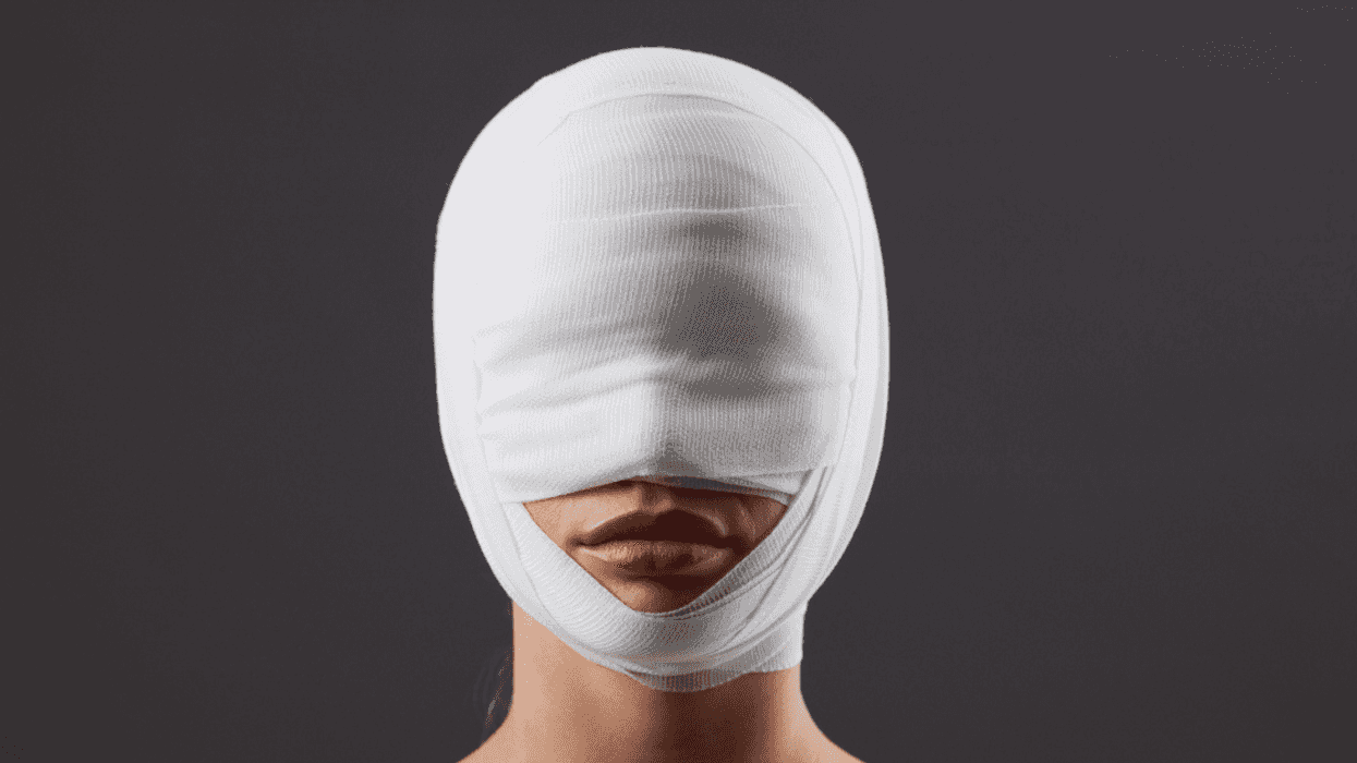 Woman with facial bandages