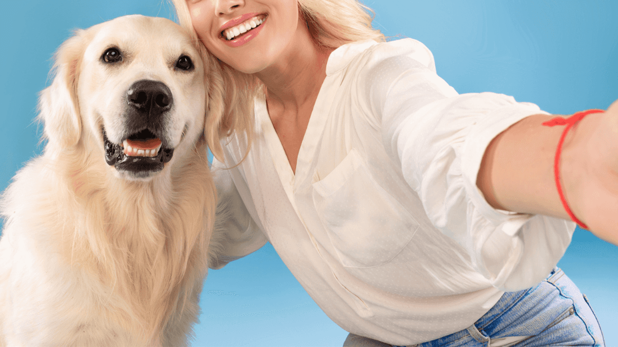 Woman with her adopted golden retriever