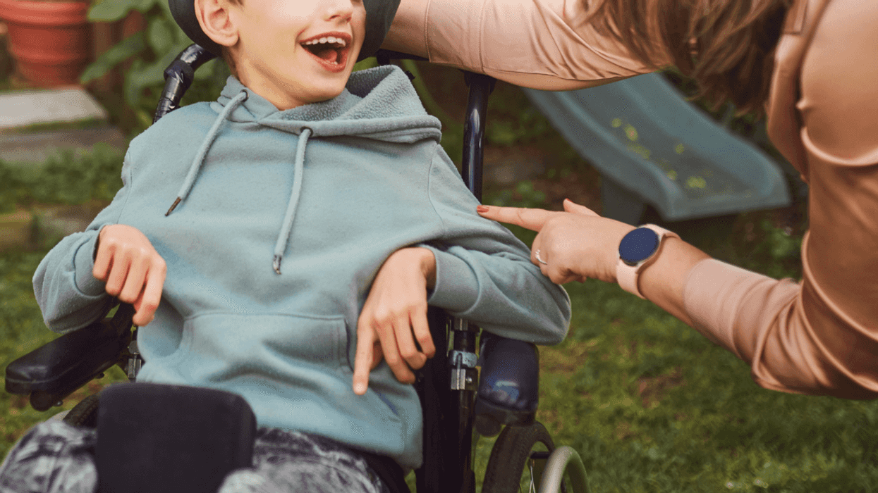Woman with son in wheelchair