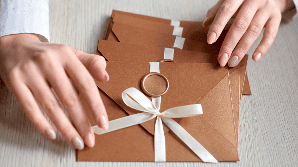 woman with wedding invitations