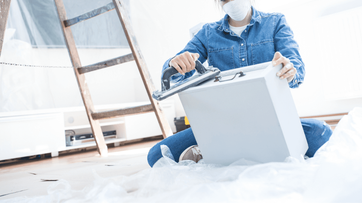 Woman working on cabinets