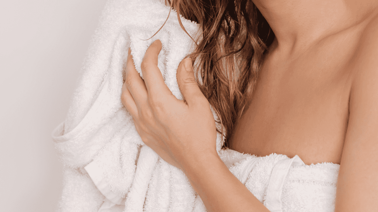 Woman wrapped in towel after a shower