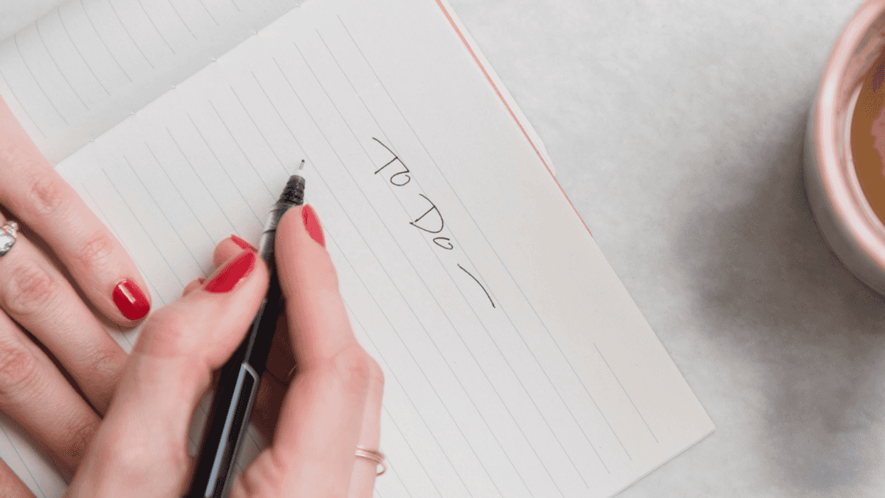 woman writing to do list