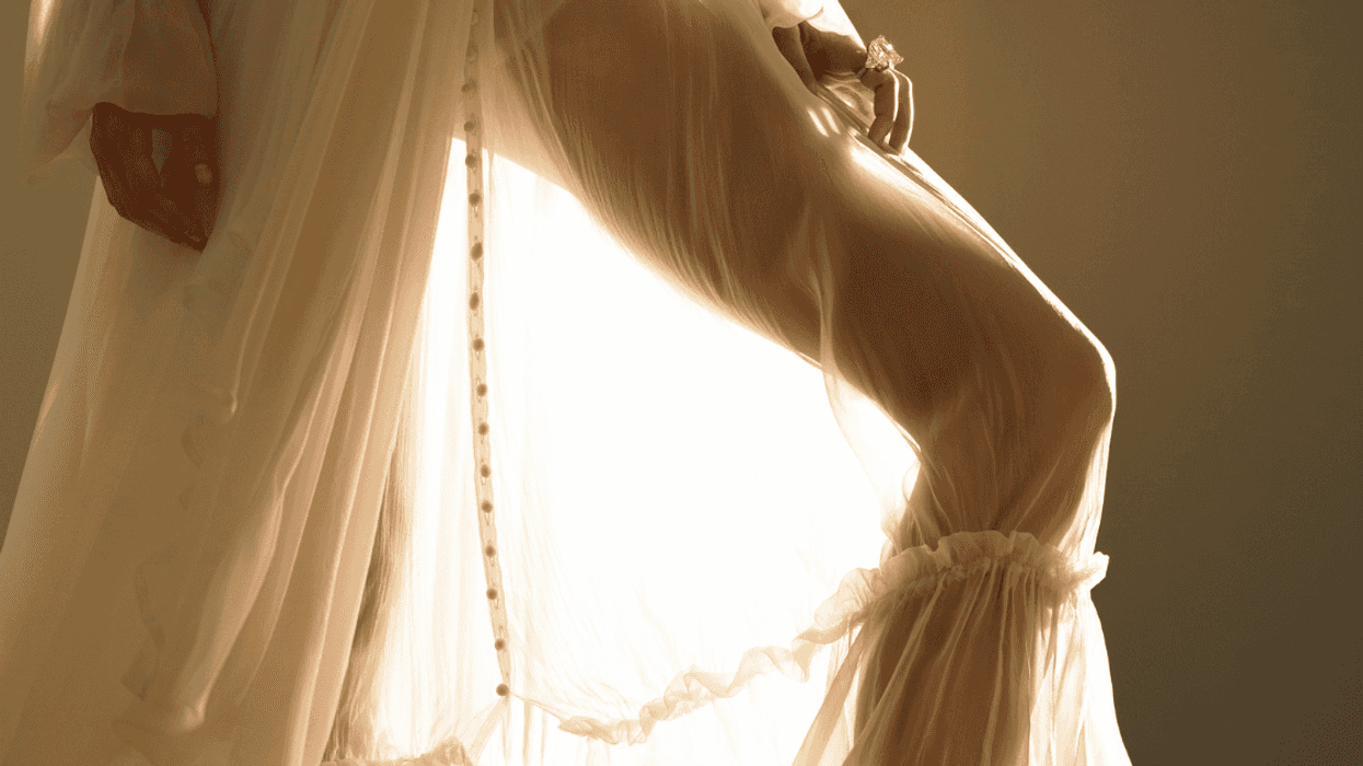 Woman’s leg showing through sheer dress