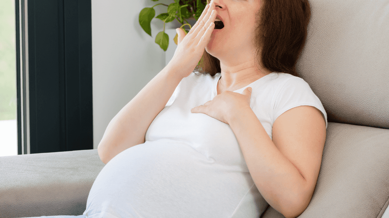yawning pregnant woman