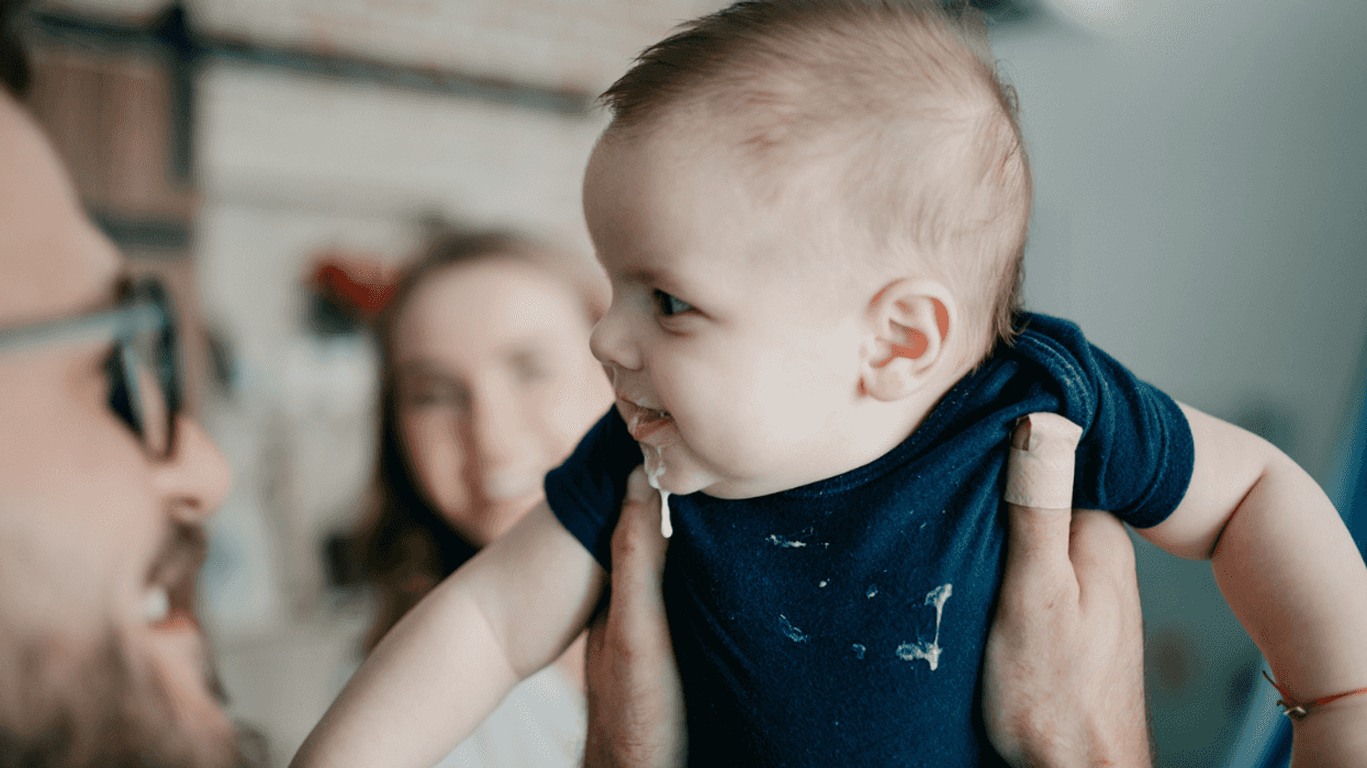 Young couple holding a baby.