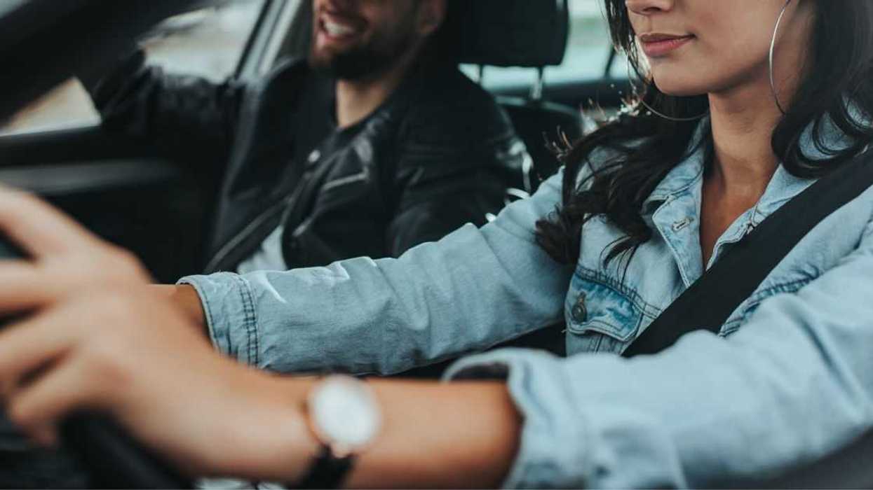 Young couple traveling by car