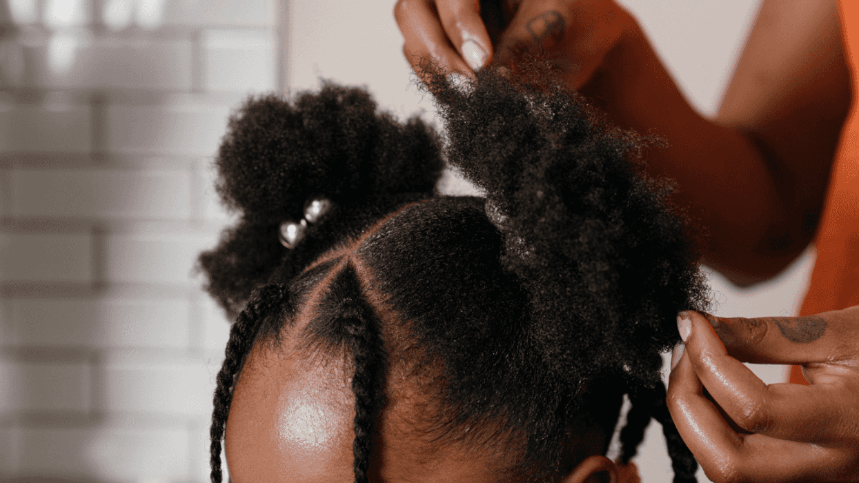 young girl getting hair styled