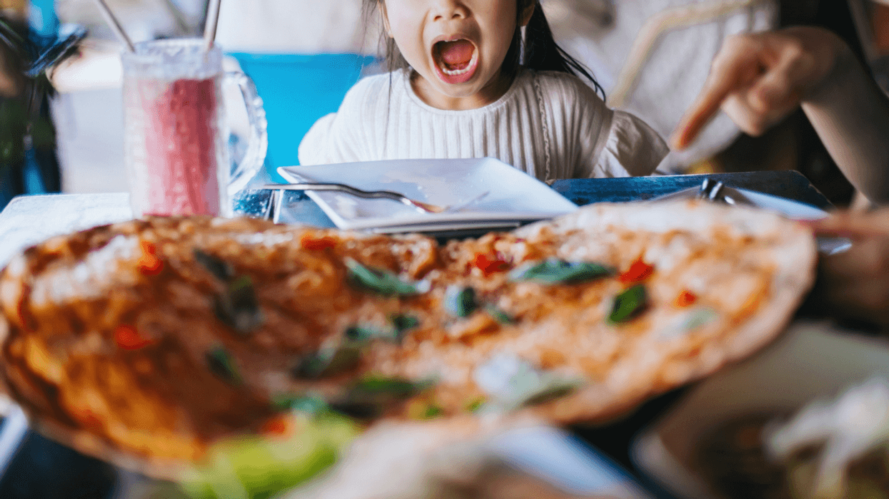 Young girl screaming in a restaurant