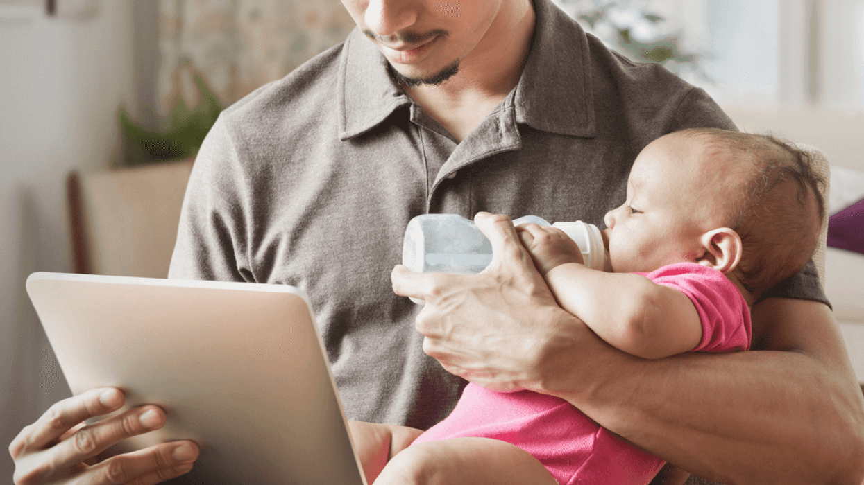 Young man giving presentation with baby