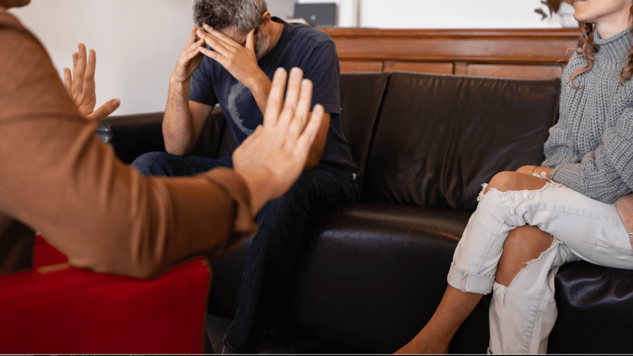 young person in discussion with older couple
