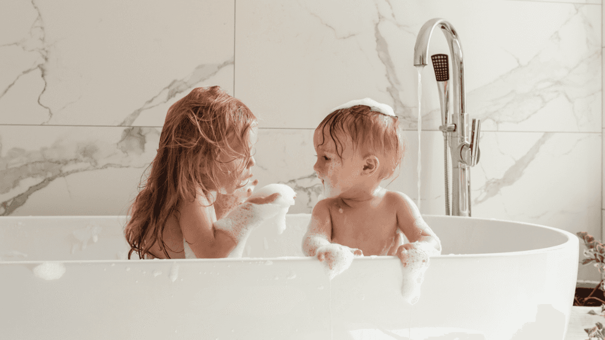 Young siblings taking bath together