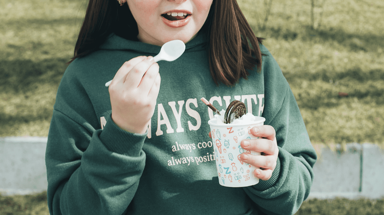 Young teen girl eating Oreos and ice cream
