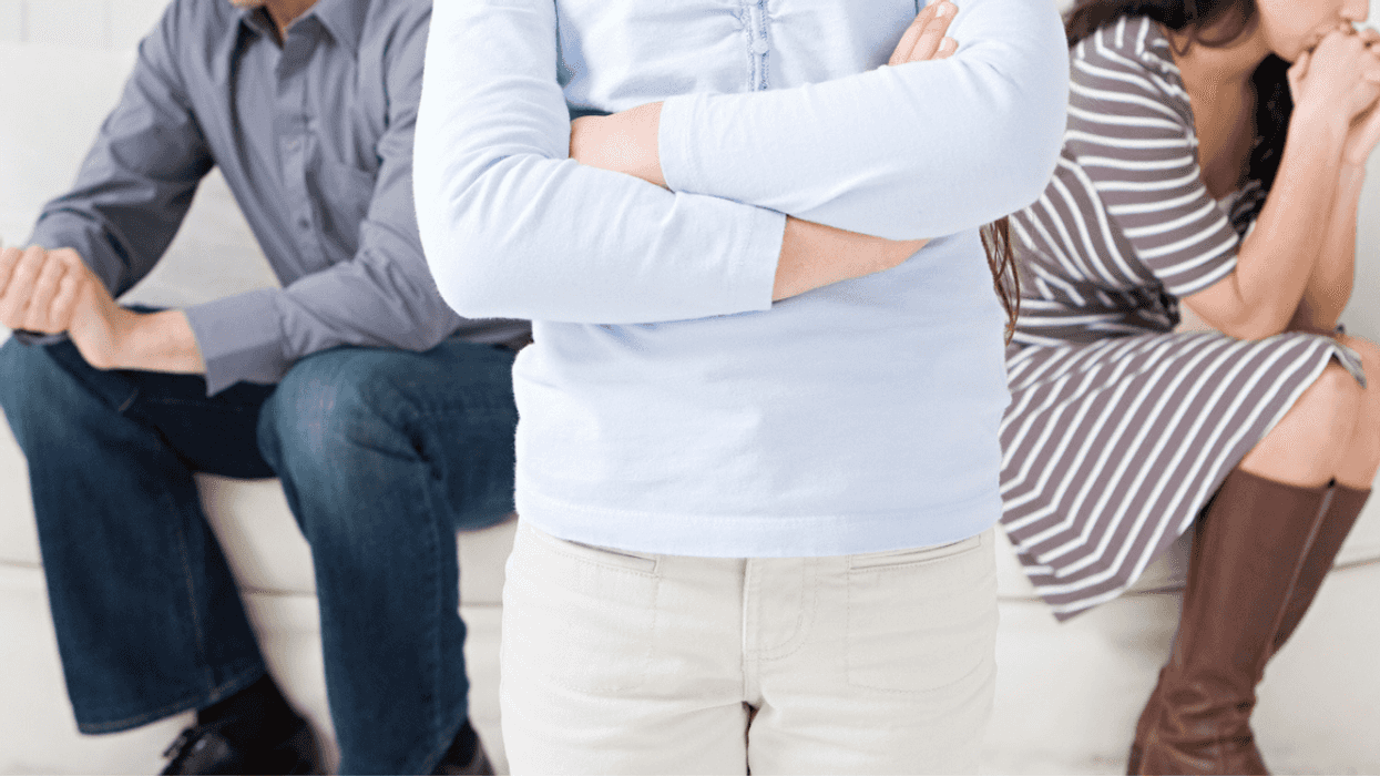 Young teen girl overhearing her parents arguing