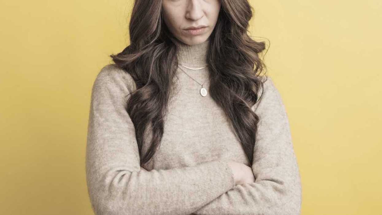 young woman with crossed arms